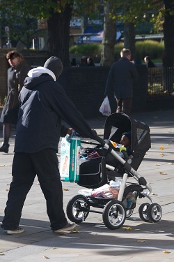 Man with child in buggy